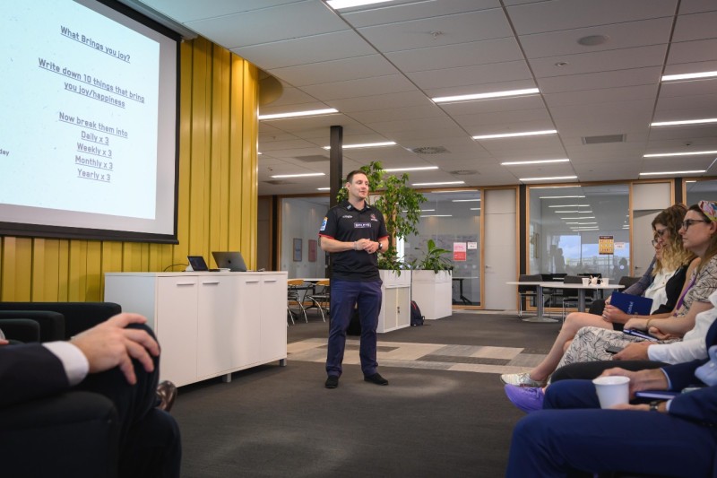 Gareth Duder presenting in front of a group of people.