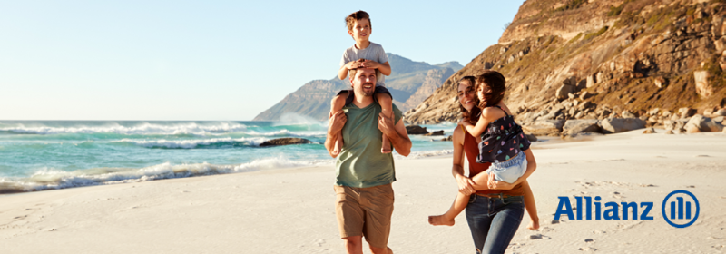Family on the beach enjoying their time together. Allianz blue logo. 